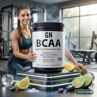 Woman holding a container of GN BCAA in a gym setting with lemon and lime slices.