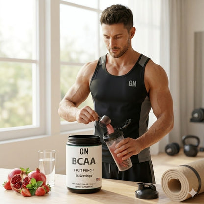 Man preparing a supplement shake with GN BCAA container in a gym setting
