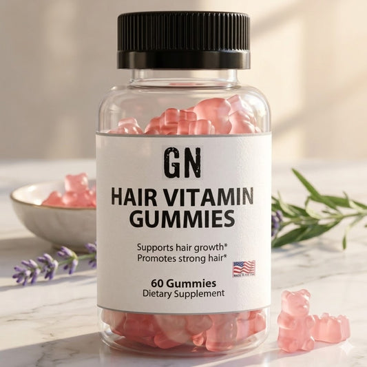 Bottle of GN Hair Vitamin Gummies with pink gummy bears on a light background