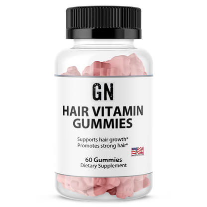 Hair vitamin gummies in a clear bottle with a black lid on a white background